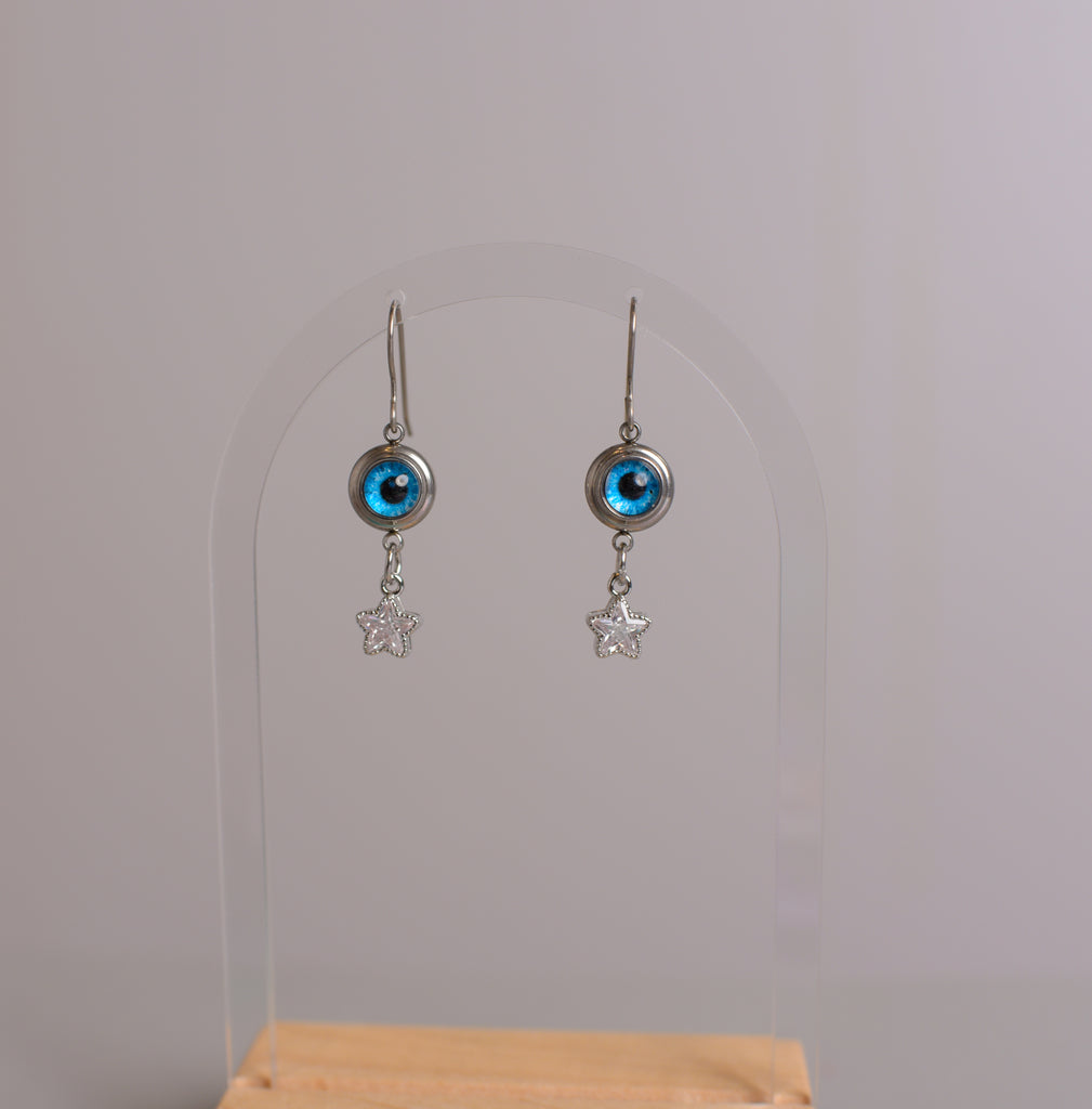 blue eye ball earrings with silver stars on titanium ear wires 