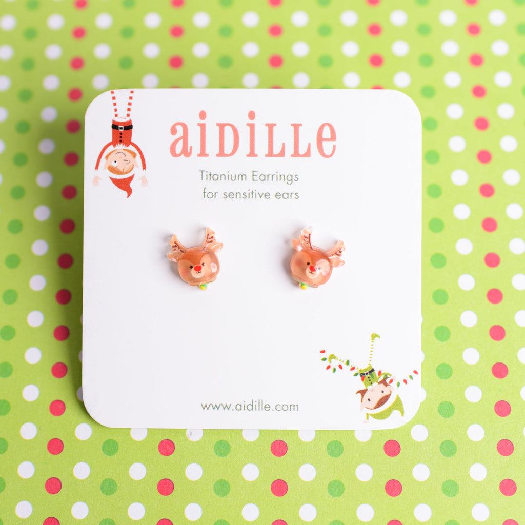 Deer-shaped earrings on a 'aidille' branded card against a polka dot background