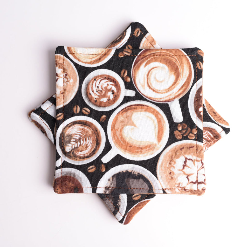 Fabric coasters in coffee-themed pattern on a white background