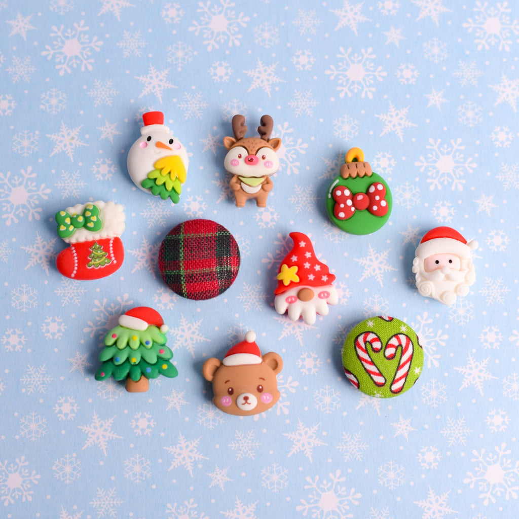 Christmas magnets or push pins on snowflake background
